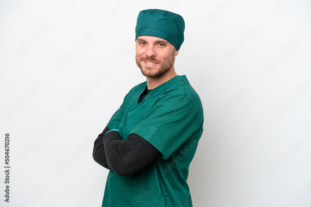 Surgeon Brazilian man in green uniform isolated on white background with arms crossed and looking forward Surgeon Brazilian man in green uniform isolated on white background with arms crossed and looking forward
