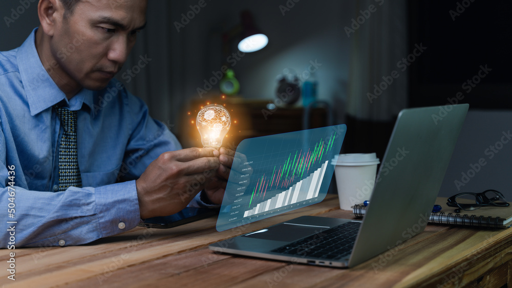 Businessman holding illuminated lightbulb, idea, Innovation and inspiration with glowing virtual brain, smart intelligent creativity with bulbs, Motivation and innovation concept.