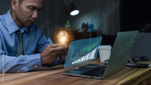 Obraz na płótnie Businessman holding illuminated lightbulb, idea, Innovation and inspiration with glowing virtual brain, smart intelligent creativity with bulbs, Motivation and innovation concept. w salonie