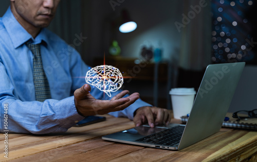 Obraz na płótnie Businessman holding illuminated lightbulb, idea, Innovation and inspiration with glowing virtual brain, smart intelligent creativity with bulbs, Motivation and innovation concept. w salonie