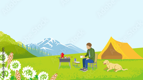 Young man and his dog enjoying camp in spring nature