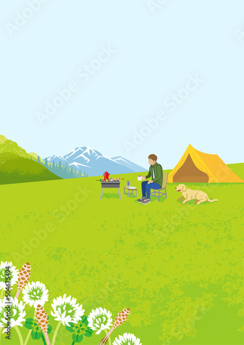 Young man and his dog enjoying camp in spring nature - Vertical