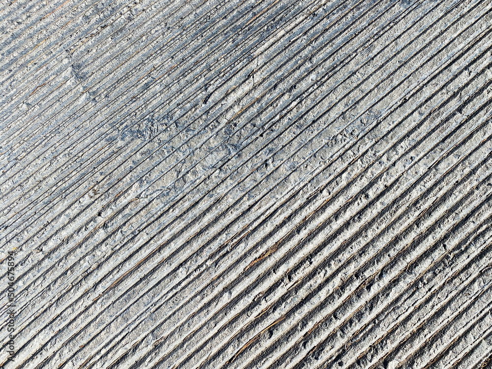 closeup pavement concrete sidewalk drainage street walkway overflow prevention tracks water rain flow closeup pavement concrete sidewalk drainage street walkway overflow prevention tracks water rain flow