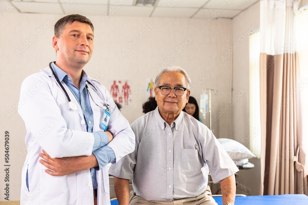 Male doctor with stethoscope standing with arms folded Looking at the camera On the background of the clinic hospital look ta camera. Male doctor with stethoscope standing with arms folded Looking at the camera On the background of the clinic hospital look ta camera.