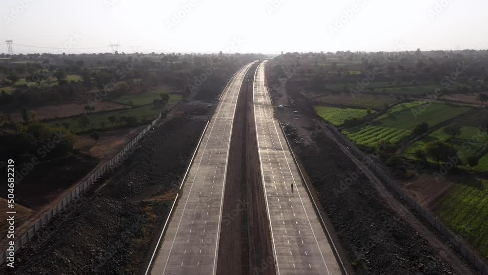 Flying Over An Excavated Roadside For Pipeline Installation With View Of Greenery Landscape. Aerial Forward Flying Over An Excavated Roadside For Pipeline Installation With View Of Greenery Landscape. Aerial Forward