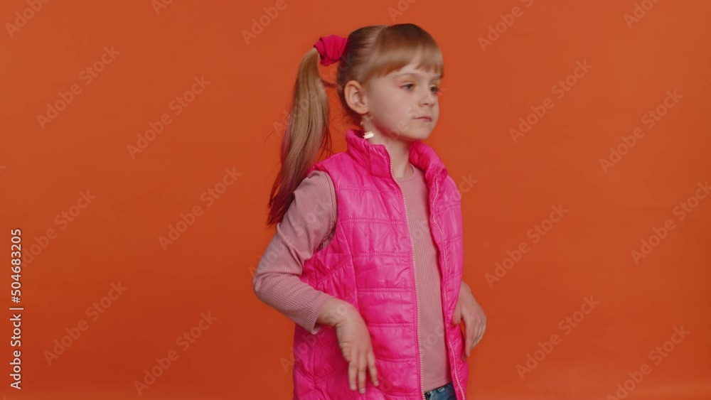 I dont want to look at this, awful. Toddler children girl closing eyes with hand showing stop gesture, confused shy scared to watch. Young little school child kid isolated on orange studio background I dont want to look at this, awful. Toddler children girl closing eyes with hand showing stop gesture, confused shy scared to watch. Young little school child kid isolated on orange studio background