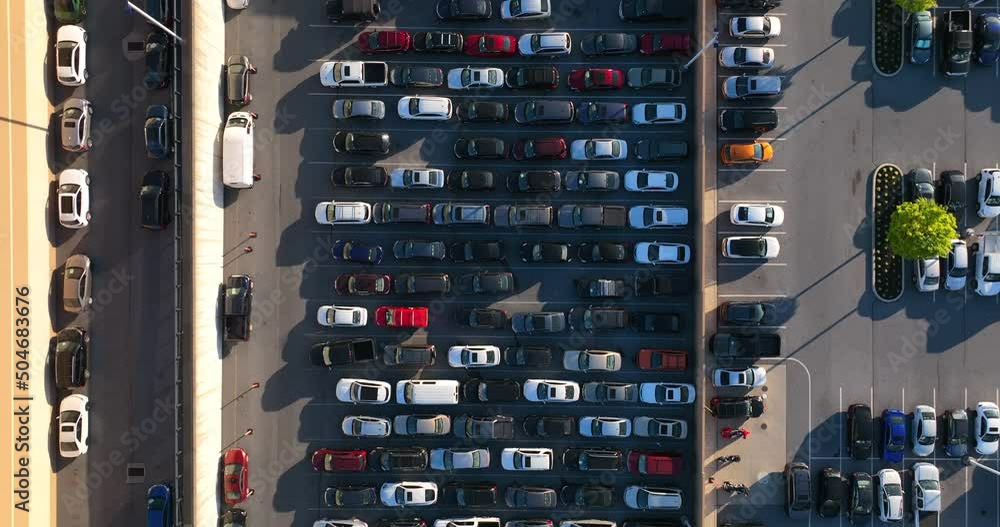 Top down aerial view of full parking lot. Cars parked in CarMax parking lot waiting to be sold. Top down aerial view of full parking lot. Cars parked in CarMax parking lot waiting to be sold.