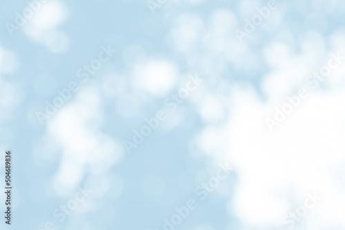 Abstract light blue blur bokeh for background, light blur on high light blue gradient abstract background in central design for presentation.