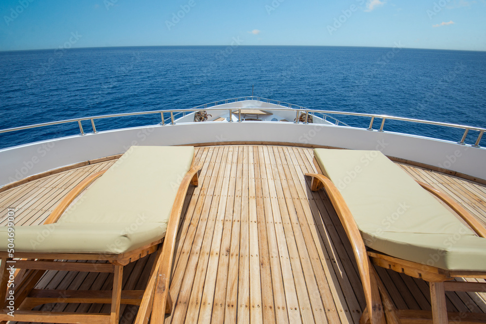 Fototapeta premium View from bow deck of luxury yacht with sunbeds
