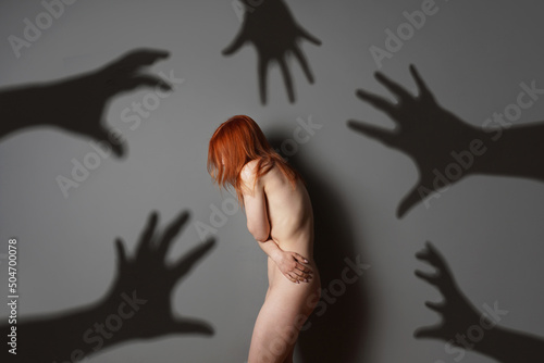 Valokuvatapetti sexual harassment or abuse concept with naked woman shadows of grabbing hands