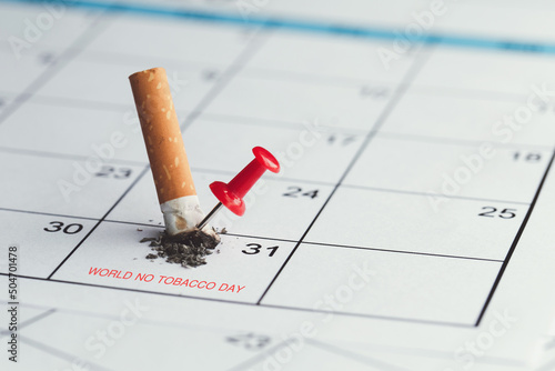 World No Tobacco Day. The cigarette broke on the May 31 calendar and had a red pin on it. the idea to stop smoking and quit smoking. world no tobacco day concept. photo