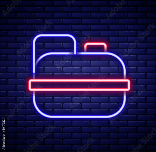 Glowing neon line Canister for gasoline icon isolated on brick wall background. Diesel gas icon. Colorful outline concept. Vector