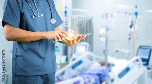 medical concept doctor holding tablet taking care of patient photo