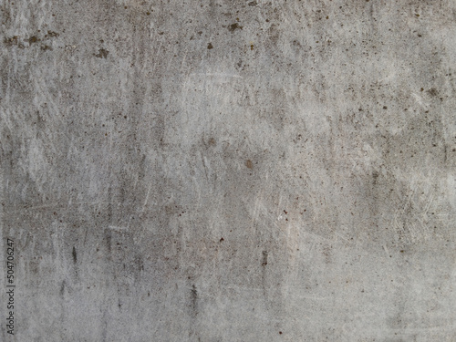 Texture of rough gray concrete surface with scratches