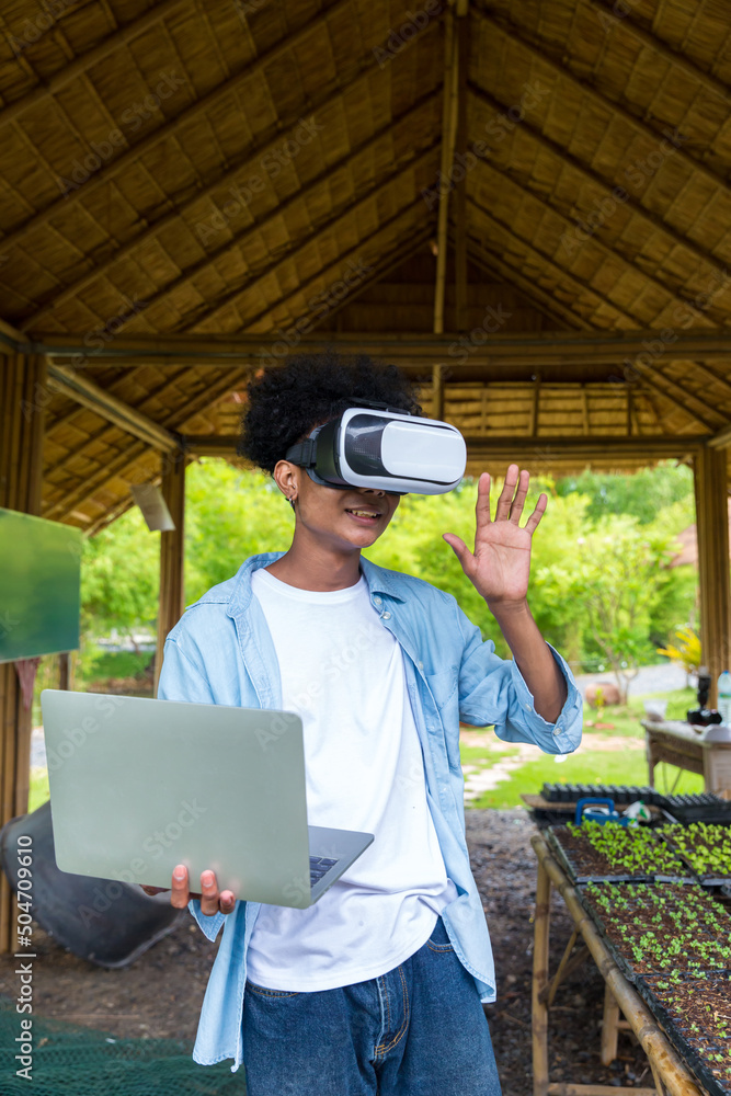 Student in virtual reality glasses playing the game or social media . scientist with vr headset in garden, concept Student in virtual reality glasses playing the game or social media . scientist with vr headset in garden, concept