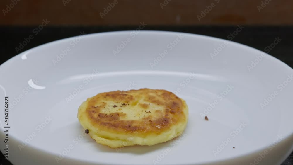 food video: plating syrniki on white plate food video: plating syrniki on white plate