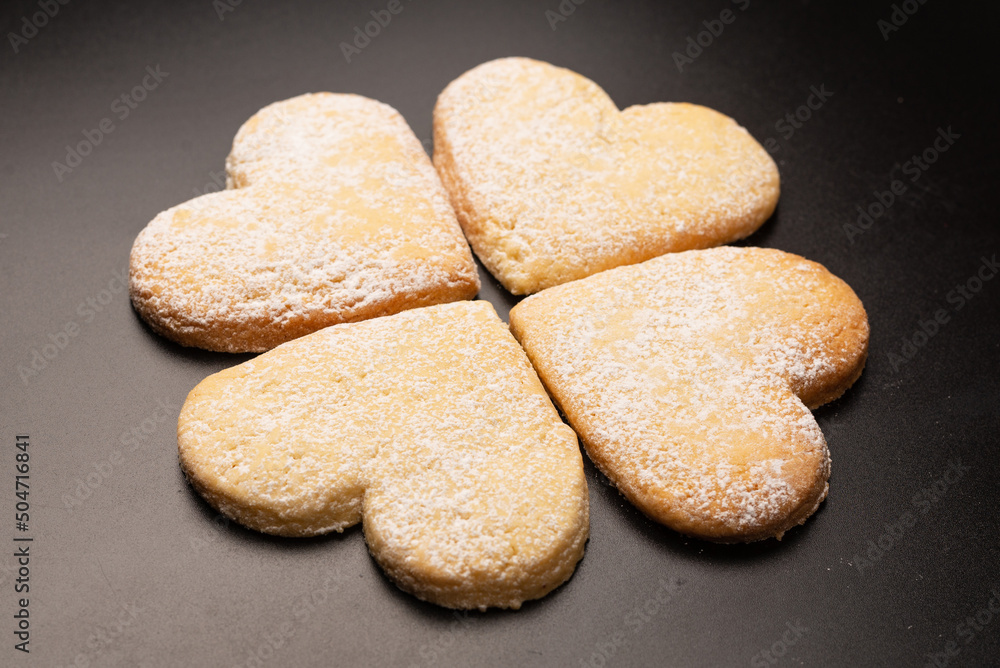 Shortbread in the shape of a heart isolated on white background. Shortbread in the shape of a heart isolated on white background.