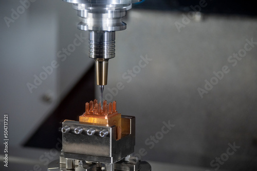 Quadro em tela The CNC milling machine cutting the copper electrode parts with sloid ball endmill