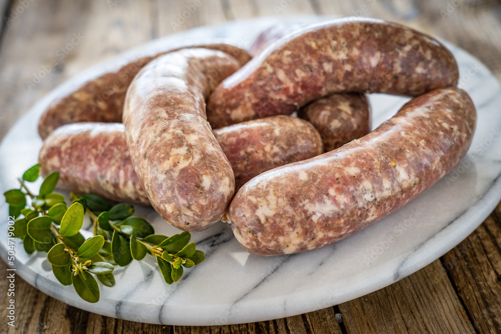 Raw white sausages on wooden table
Raw white sausages on wooden table