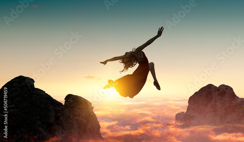 Female dancer against sunse...