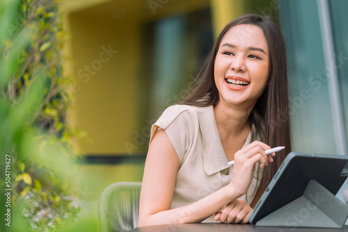Free Download asian female digital nomad happiness freedom cheerful smiling working using tablet in garden outdoor,asia woman freelance relax leisure working anywhere work and travel iwith garden bokeh background - GFXLoad