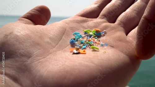 Close-up shot of microplastics particles. The concept for water pollution and global warming.  Climate change idea. Soft focus of micro plastic that cannot be recycled