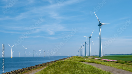 Φωτογραφία Offshore Windmill farm in the ocean Westermeerwind park, windmills isolated at sea on a beautiful bright day Netherlands Flevoland Noordoostpolder