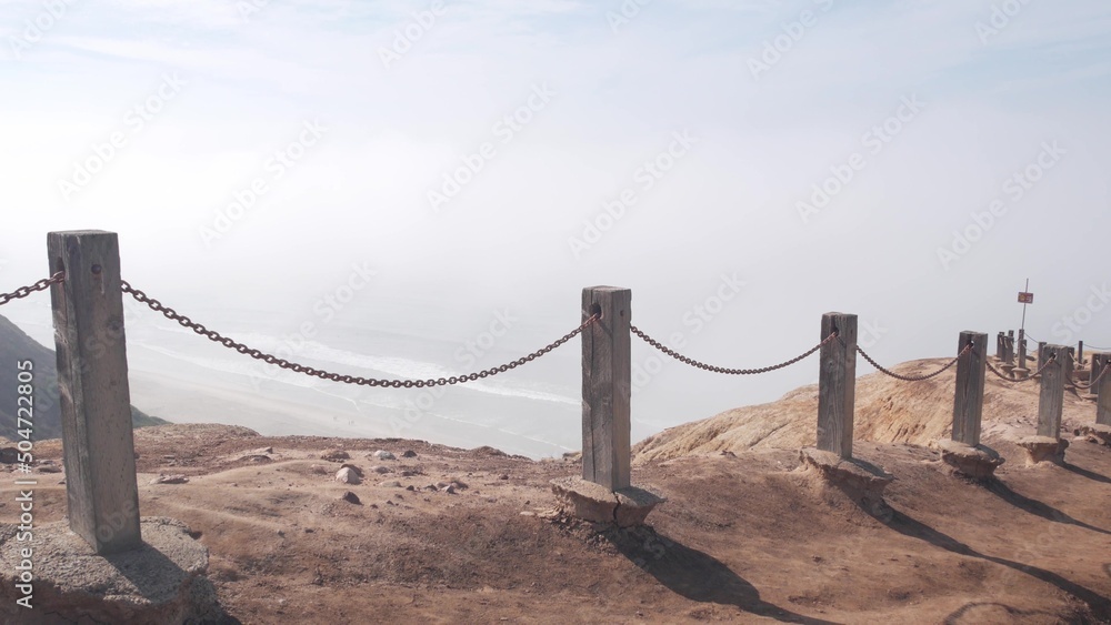 Steep unstable cliff, rock or bluff, foggy weather, California coast
