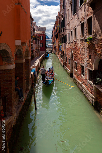 Gondoliers on the canals of Venice carry tourists..  © Andrey