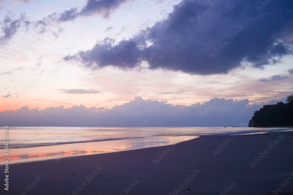 Empty beach with the orange blue cloudy sky shot in kalapathar beach havelock andaman nicobar island India