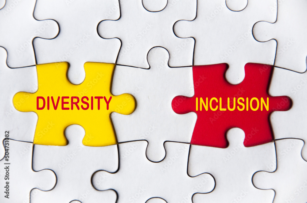 Fototapeta premium Diversity and inclusion text on missing jigsaw puzzle. Diversity concept