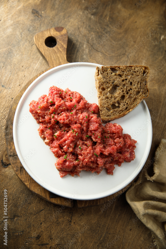 Homemade steak tartare with rye bread Homemade steak tartare with rye bread