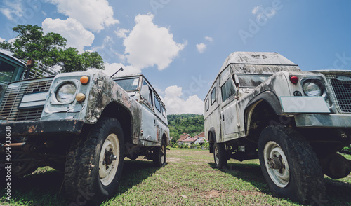 Old rusty cars for safari in the jungle of Africa