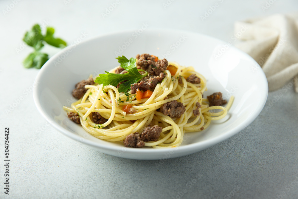 Spaghetti with meat ragout and vegetables