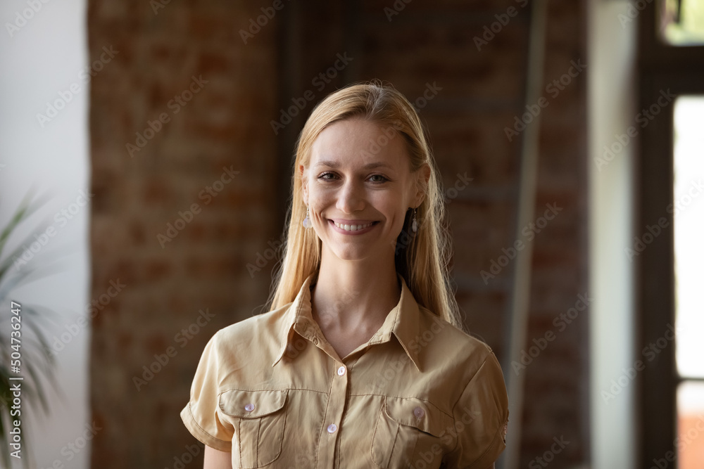 Head shot blonde businesswoman posing indoor smile staring at camera feels happy. Student and higher education, professional occupation, high-school or university qualified teacher concept portrait Head shot blonde businesswoman posing indoor smile staring at camera feels happy. Student and higher education, professional occupation, high-school or university qualified teacher concept portrait