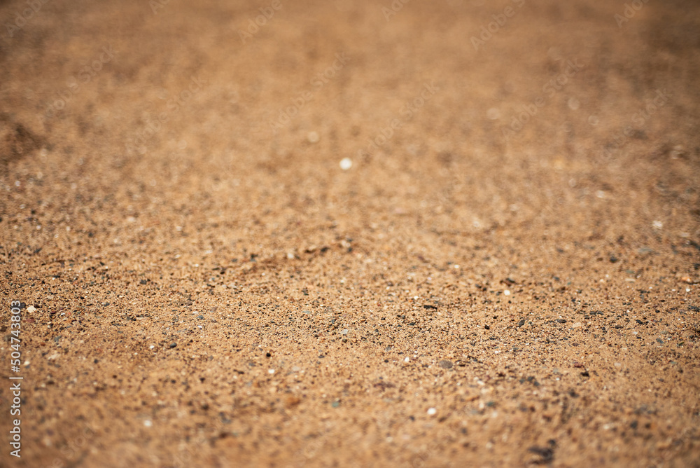 Sharp sand. Construction sand for laying paving slabs. Closeup shot of