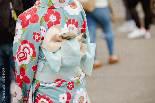 Fotografie Back view of a woman wearing a yukata