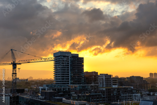 Canvas Print Beautiful sunset colors illuminating the sky over high rise apartment buildings