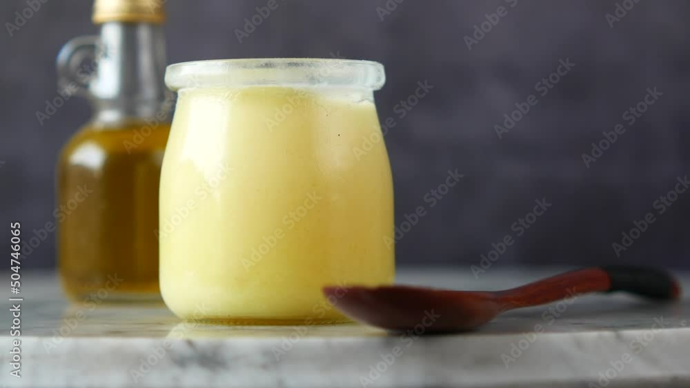homemade ghee in container on a table , homemade ghee in container on a table ,