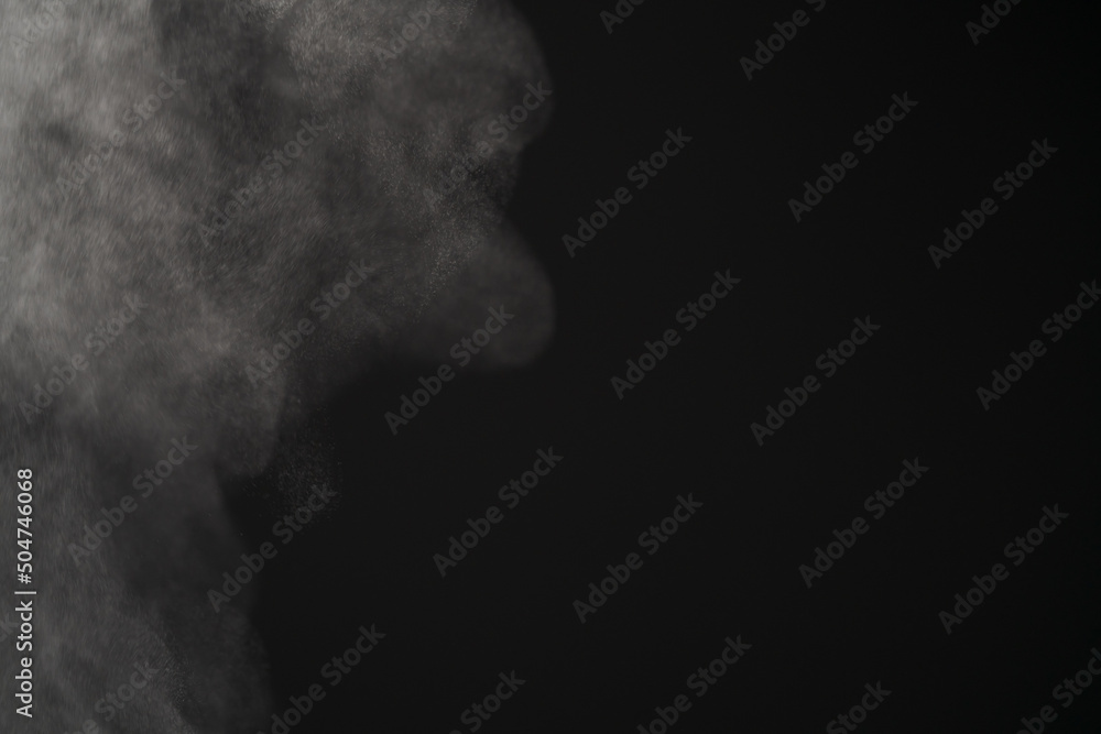 Closeup of water steam over black background
