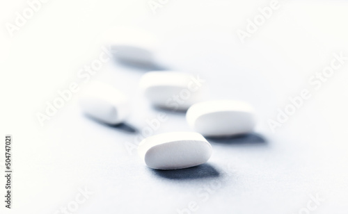 Lysine tablets. Concept for a healthy dietary supplementation. Nervous System Support. Soft focus. Bright background. Close up. Copy space. 