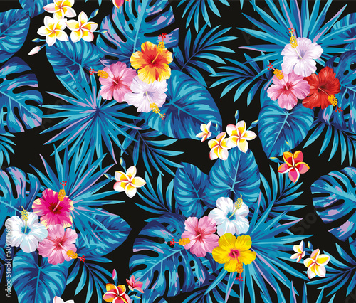 Tropical seamless pattern with exotic flowers and leaves. Floral design on a black background. Vector illustration.