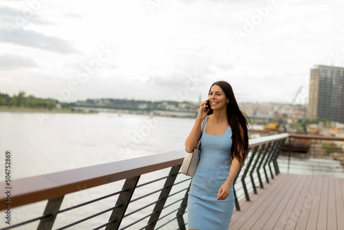 Young woman using a mobile ...