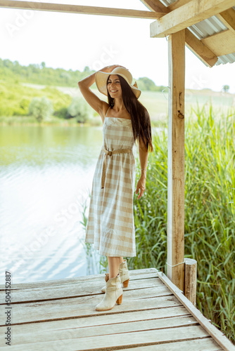Young woman standing on the...