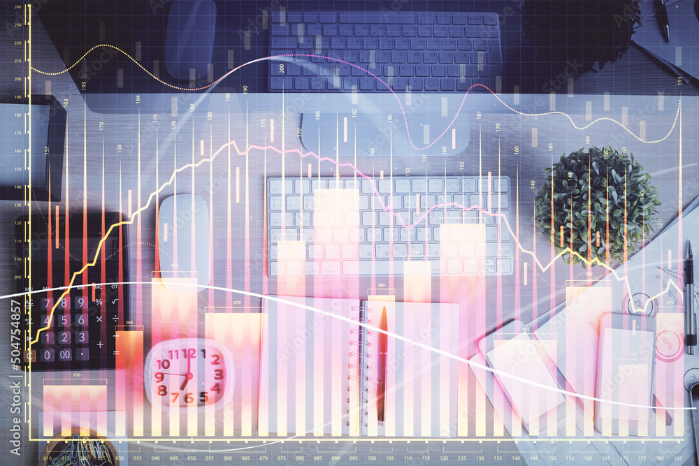 Multi exposure of forex graph drawing over desktop background with computer. Concept of financial analysis. Top view. Multi exposure of forex graph drawing over desktop background with computer. Concept of financial analysis. Top view.
