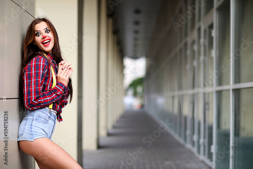 Cute girl in a clown makeup