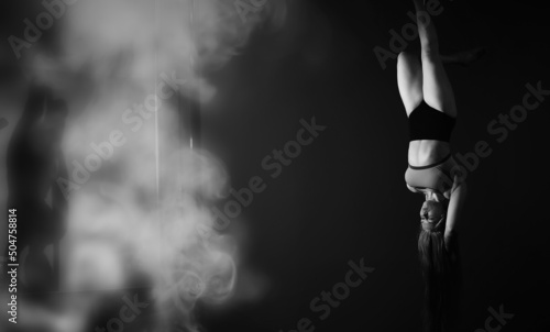 Wallpaper Mural The dancer on the pylon in the studio. Girl doing exercises on a sports equipment. Torontodigital.ca