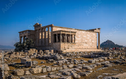 The famous Caryatides statues on the Erechtheion temple on Acropolis of Athens, Greece. photo