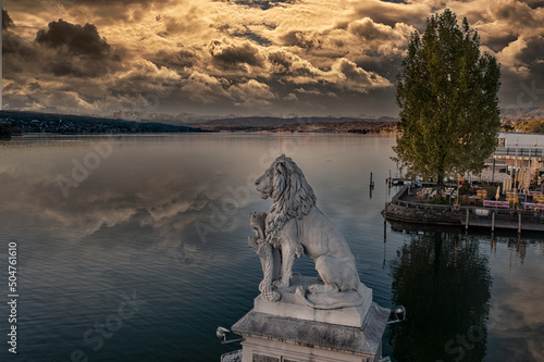 view over the zurich lake  with a lion monument 