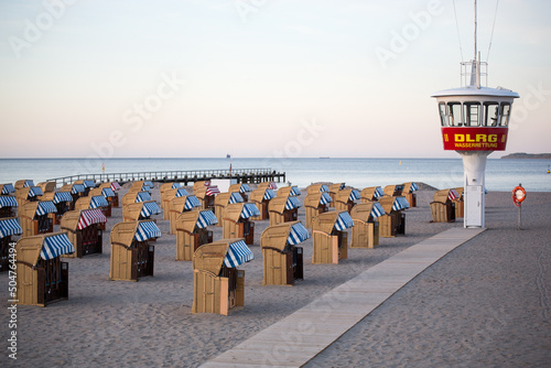 German coast of baltic sea with beach chairs and DLRG (German Life Saving Association) photo